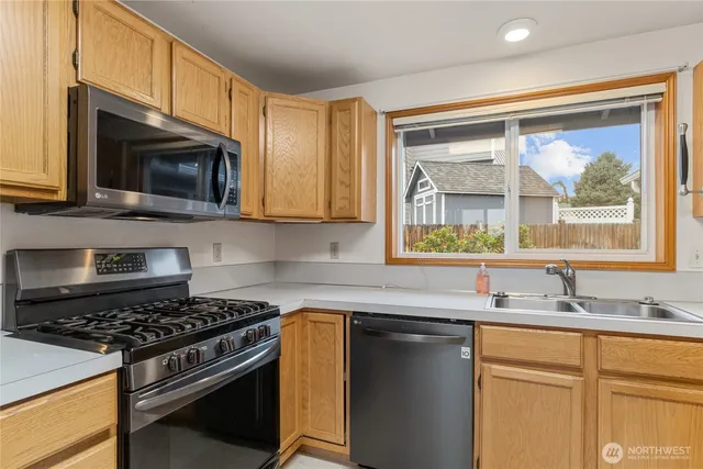 a view of an empty room and a window
