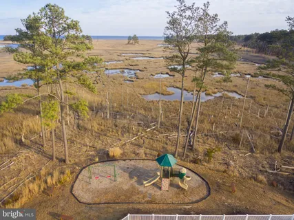 a view of a swimming pool with a table and chairs