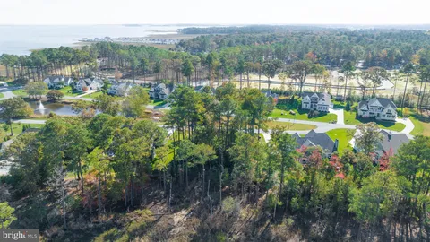 a view of a town with mountains in the background