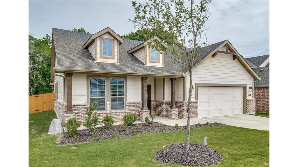 709 Copley Street Sherman, TX 75090 - Photo 1 of 27 a front view of a house with a yard