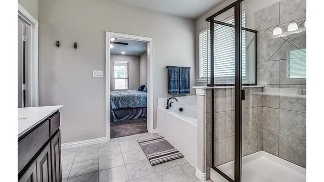 a en suite bathroom with a sink and a mirror