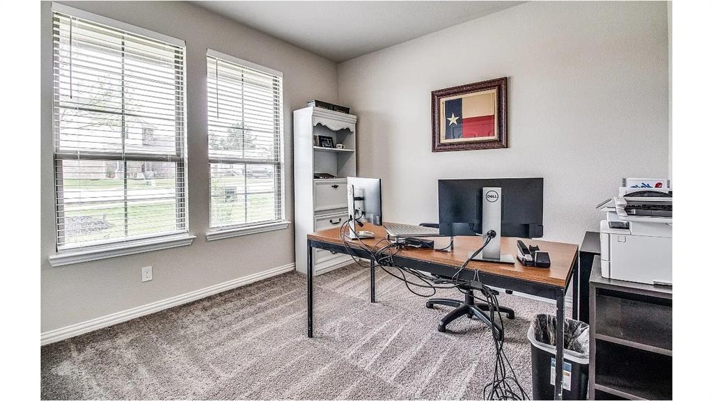 709 Copley Street Sherman, TX 75090 - Photo 17 of 27 a view of a workspace with furniture and a window