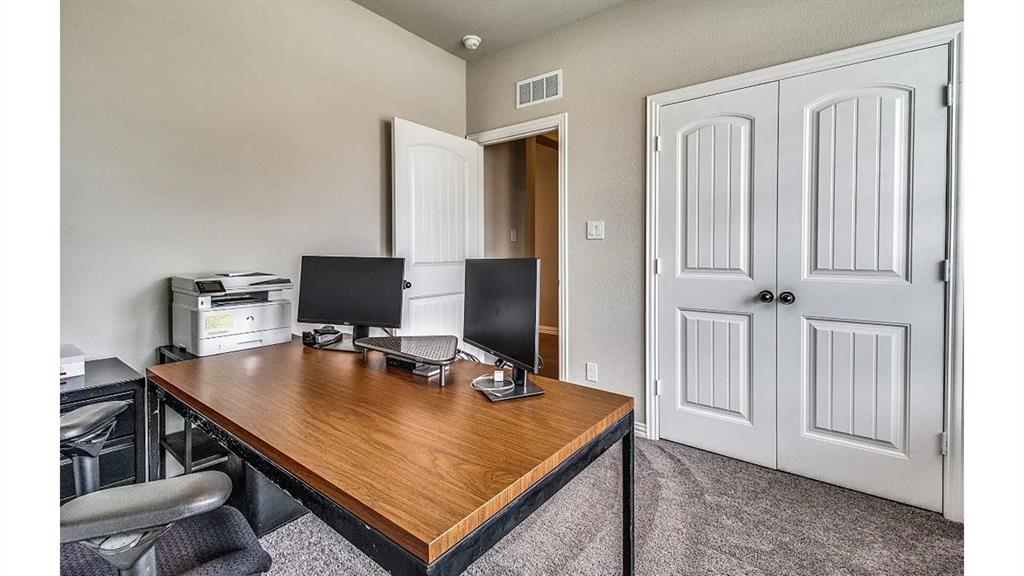 709 Copley Street Sherman, TX 75090 - Photo 18 of 27 a view of a workspace with furniture