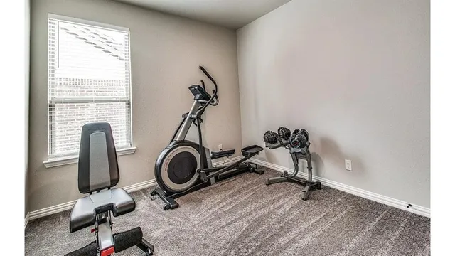 a view of a room with gym equipment