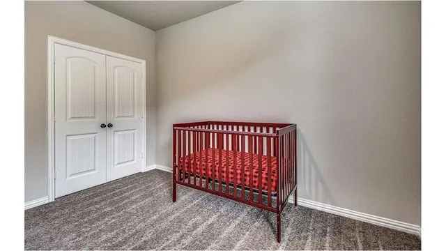 a view of a room with wooden floor and windows