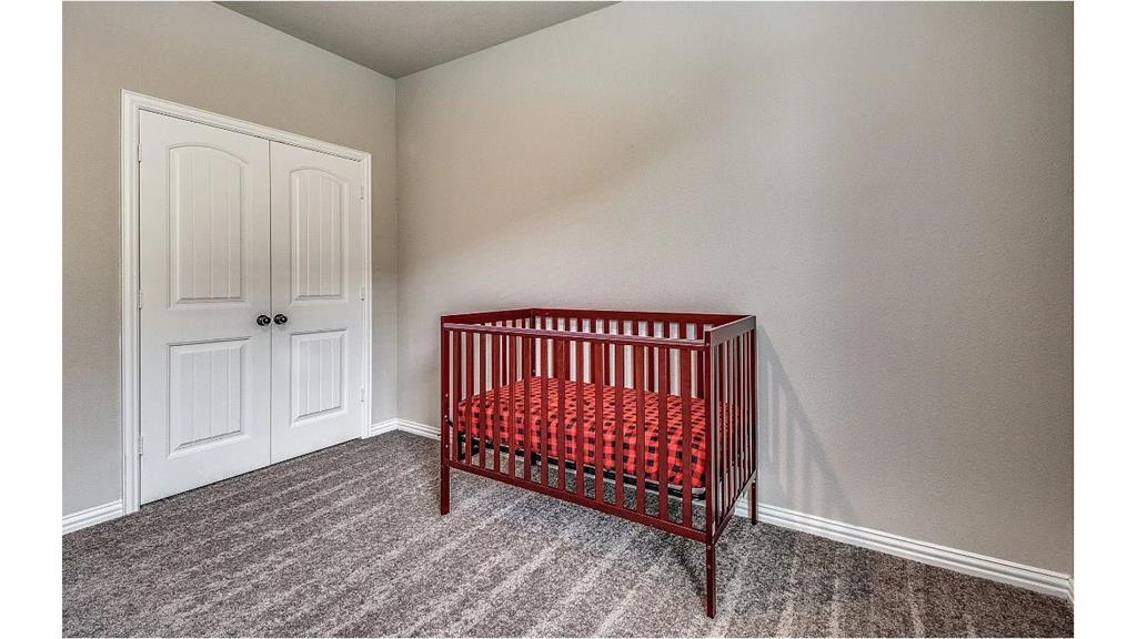 709 Copley Street Sherman, TX 75090 - Photo 21 of 27 a view of a room with wooden floor and windows
