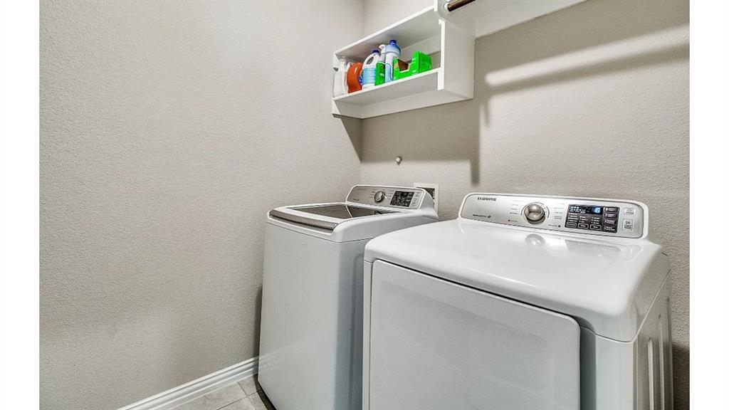 709 Copley Street Sherman, TX 75090 - Photo 23 of 27 a utility room with dryer and washer