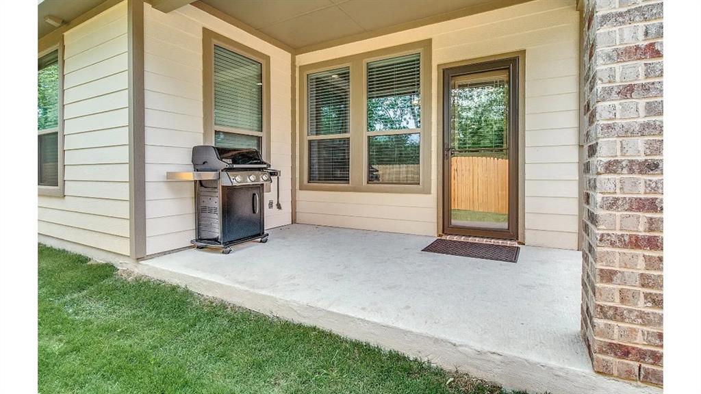 709 Copley Street Sherman, TX 75090 - Photo 25 of 27 a view of a kitchen with a sink and a stove top oven