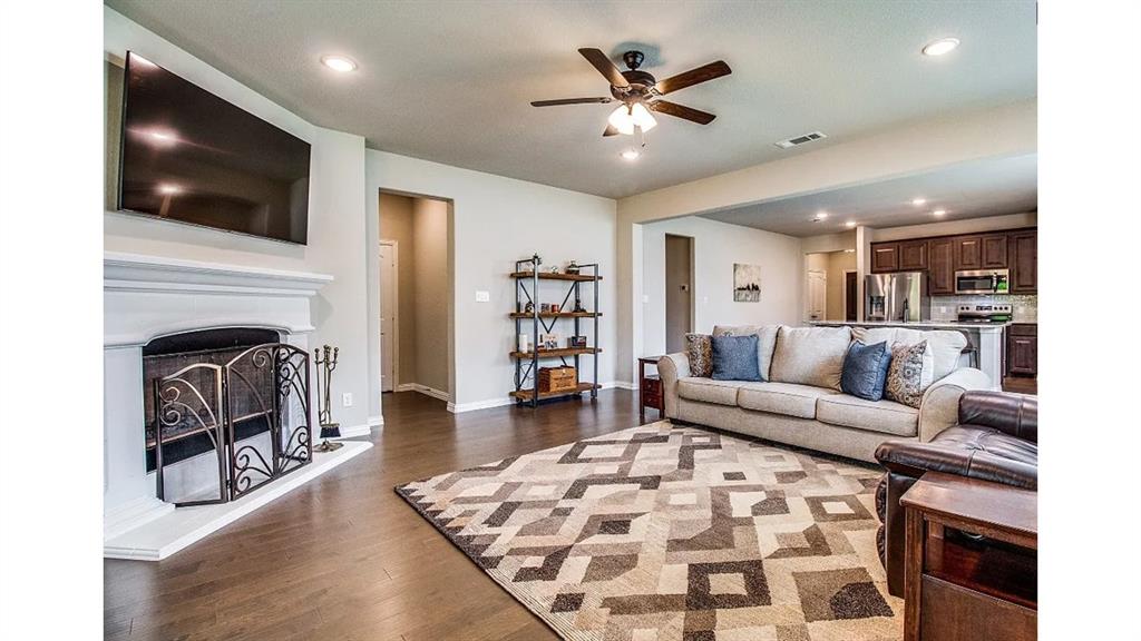 709 Copley Street Sherman, TX 75090 - Photo 5 of 27 a living room with furniture and a flat screen tv
