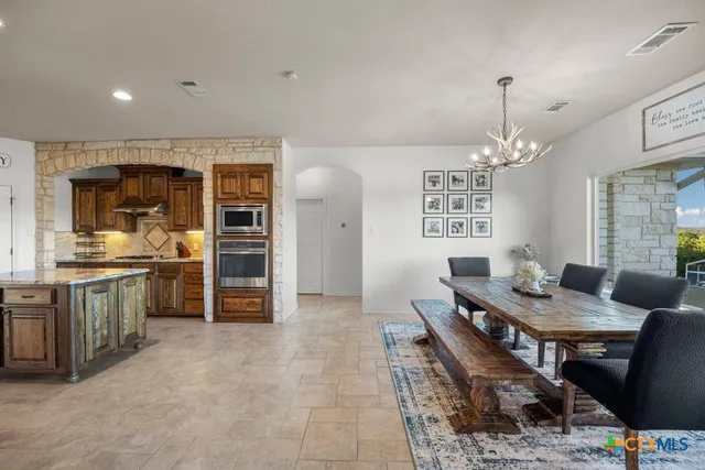 a bedroom with a bed and a dresser in it