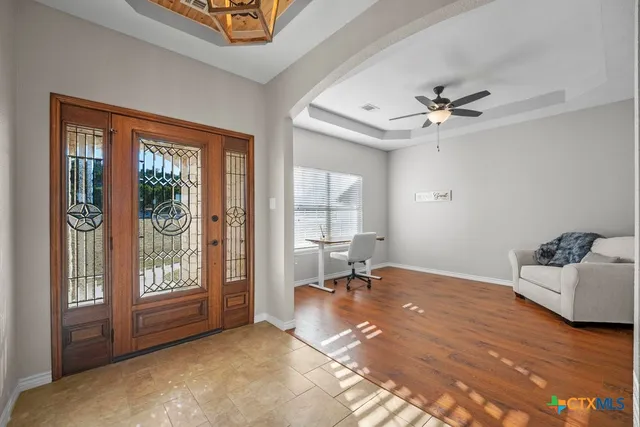 a view of a living room and wooden floor