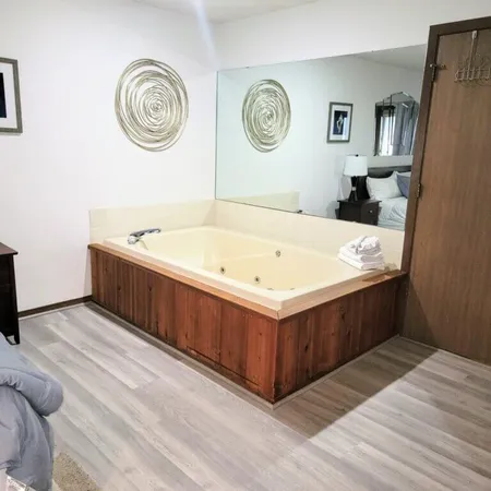 a view of a bathroom with a sink and a mirror