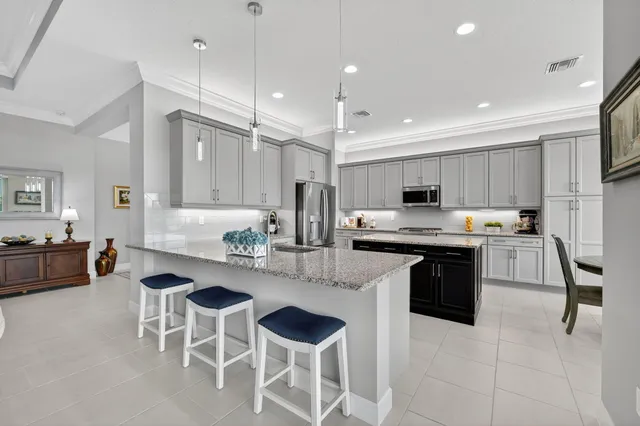 a spacious bedroom with a bed and a large window