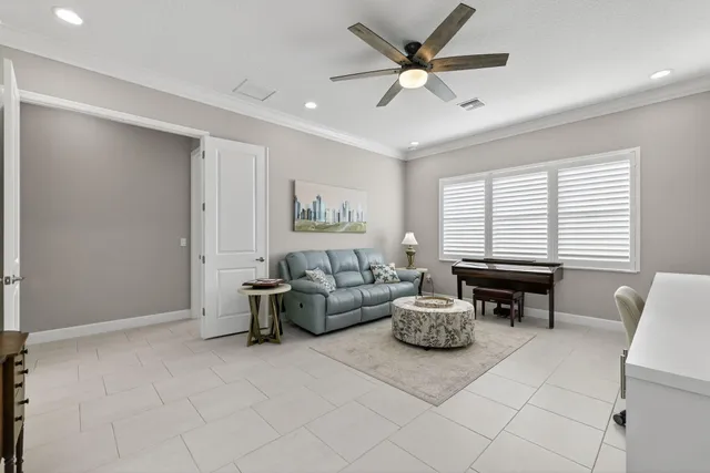 a street sign on a wall next to a road