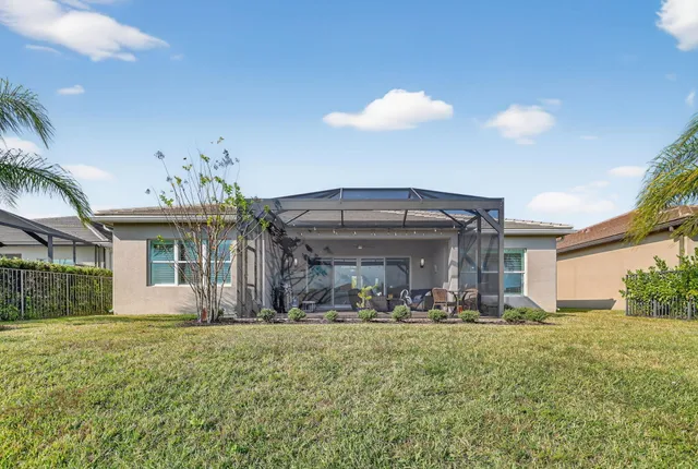a view of a swimming pool with a yard