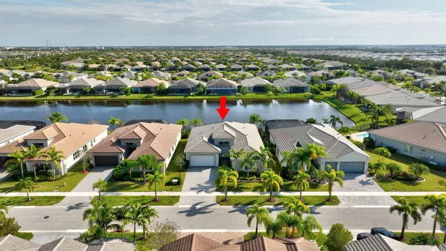 a living room with furniture a large window and a clock