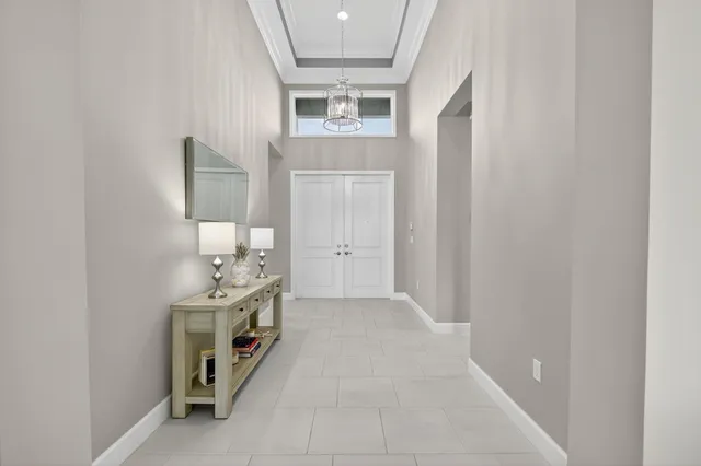 a view of a dining room with furniture wooden floor and chandelier