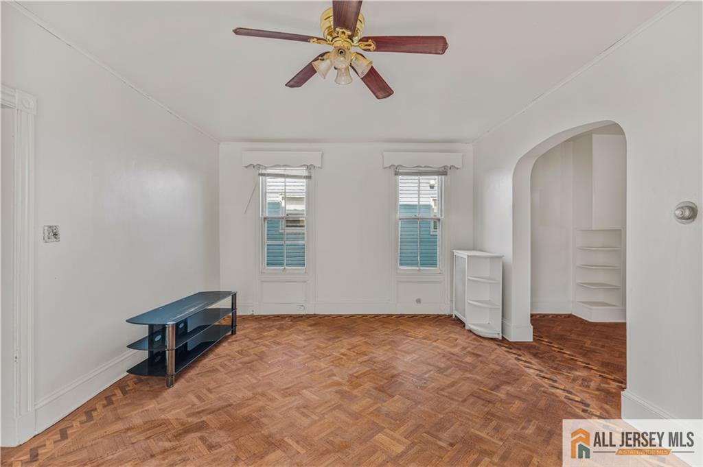 216 Handy Street New Brunswick, NJ 08901 - Photo 14 of 34 a view of room with window and ceiling fan