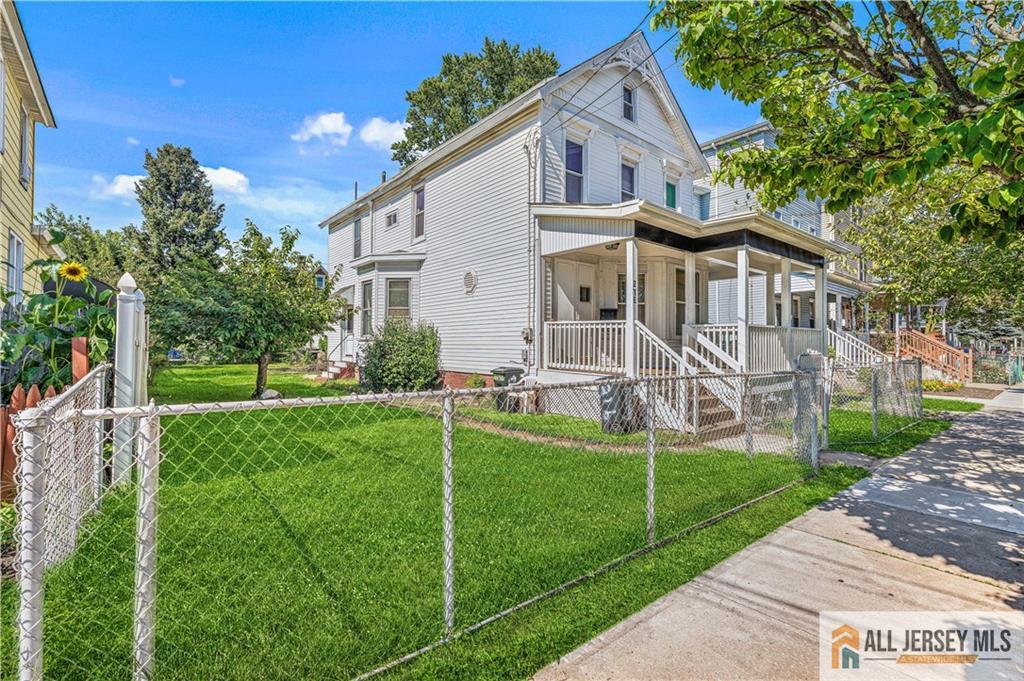 216 Handy Street New Brunswick, NJ 08901 - Photo 2 of 34 a front view of house with yard and green space