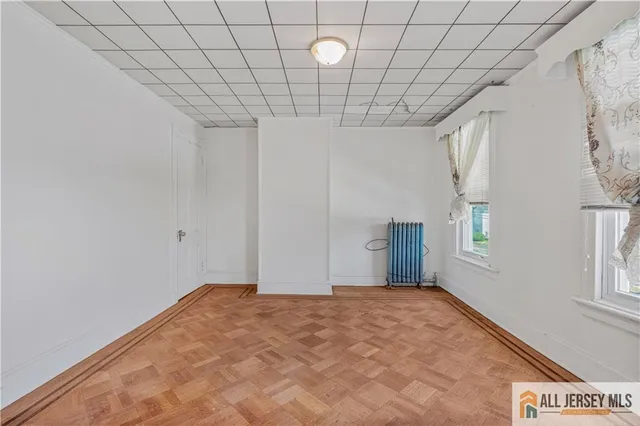 a view of a livingroom with an empty space and window
