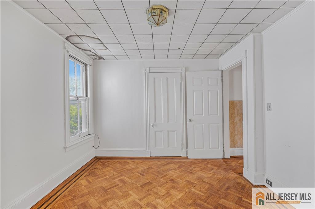 216 Handy Street New Brunswick, NJ 08901 - Photo 23 of 34 a view of a livingroom with an empty space and window