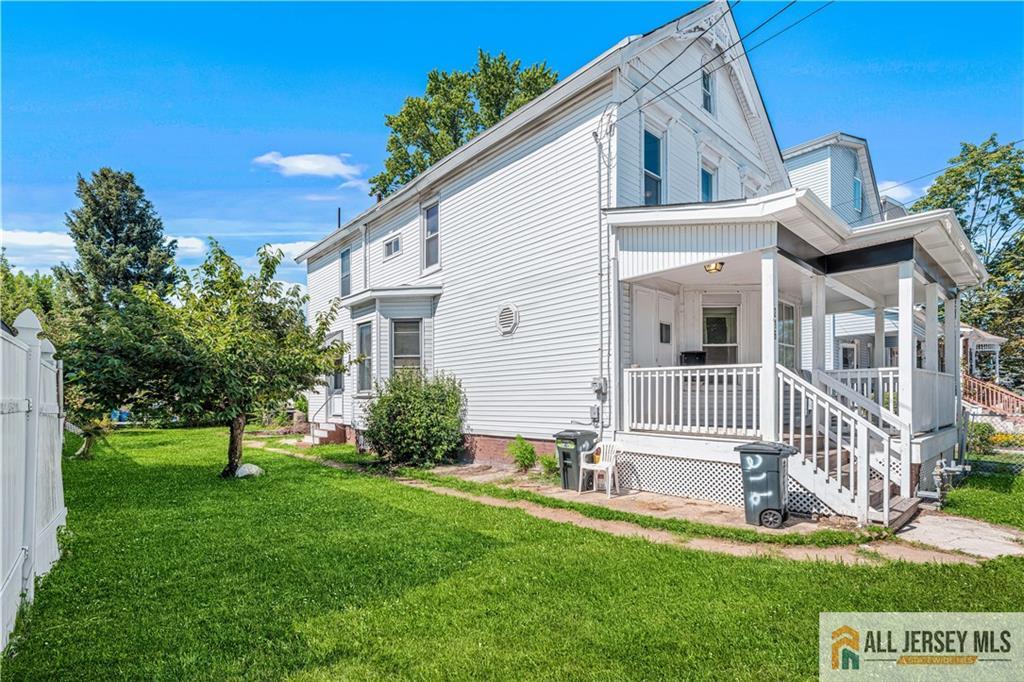 216 Handy Street New Brunswick, NJ 08901 - Photo 29 of 34 a view of a house with a yard and a garden