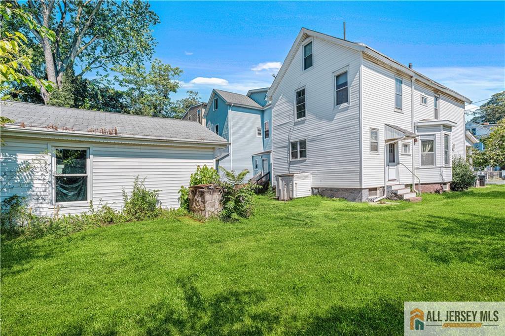 216 Handy Street New Brunswick, NJ 08901 - Photo 30 of 34 a front view of a house with a garden