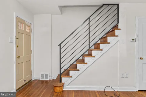 a view of entryway with wooden floor
