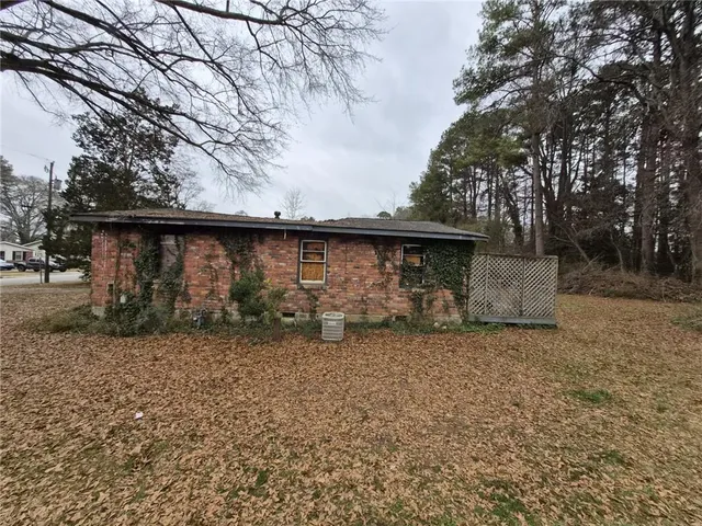 a backyard of a house with lots of green space