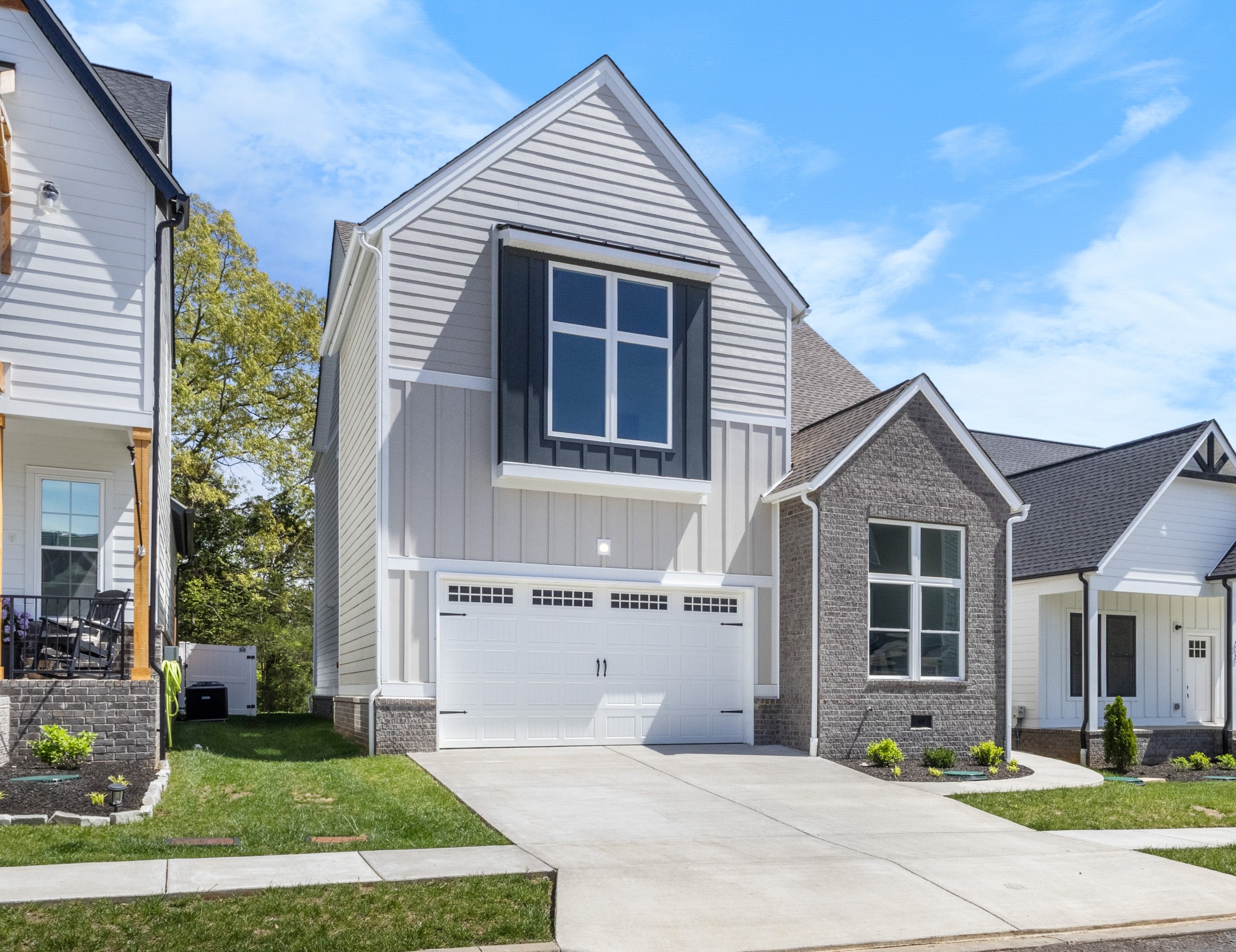463 Centre Street Pleasant View, TN 37146 - Photo 1 of 43 a front view of a house with a garden and yard