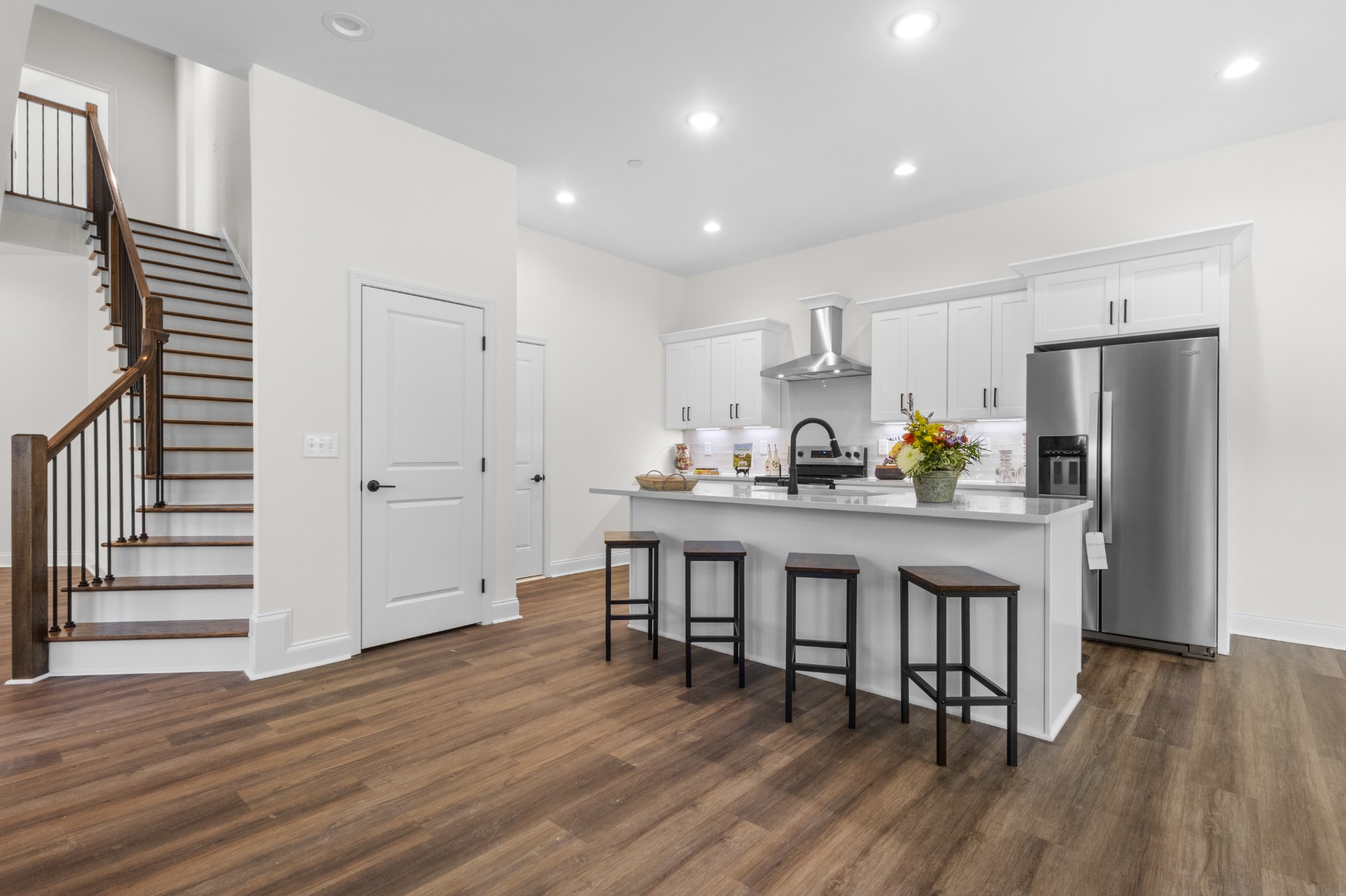 463 Centre Street Pleasant View, TN 37146 - Photo 14 of 43 a kitchen with stainless steel appliances a dining table chairs and wooden floor