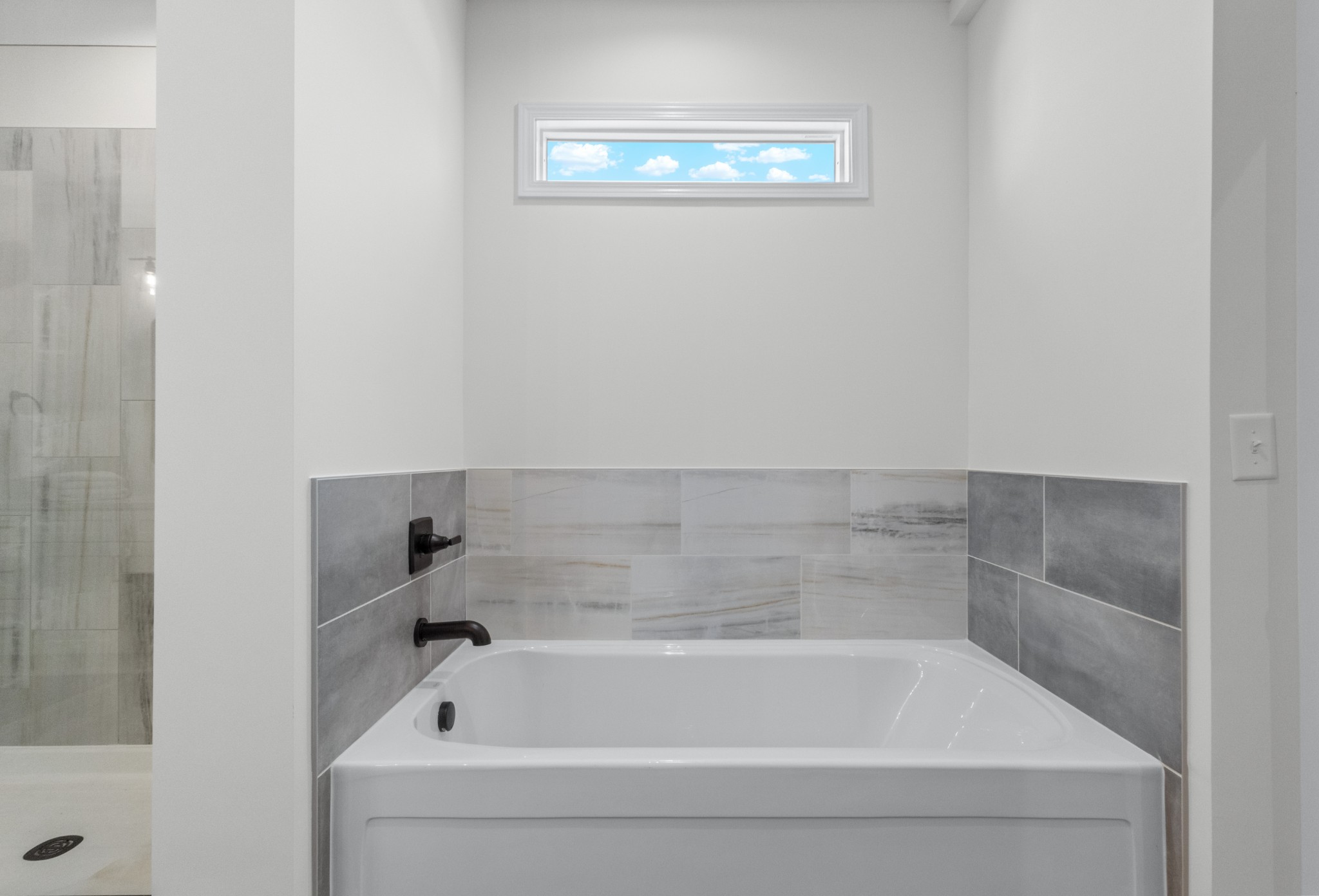 463 Centre Street Pleasant View, TN 37146 - Photo 17 of 43 a bathroom with a tub