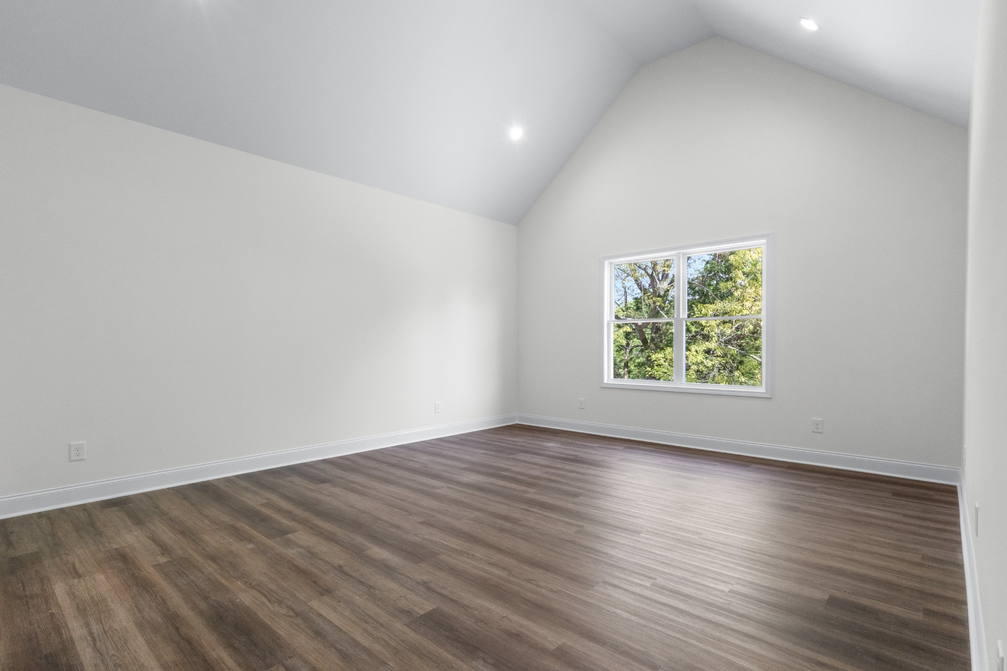 463 Centre Street Pleasant View, TN 37146 - Photo 22 of 43 an empty room with wooden floor and windows