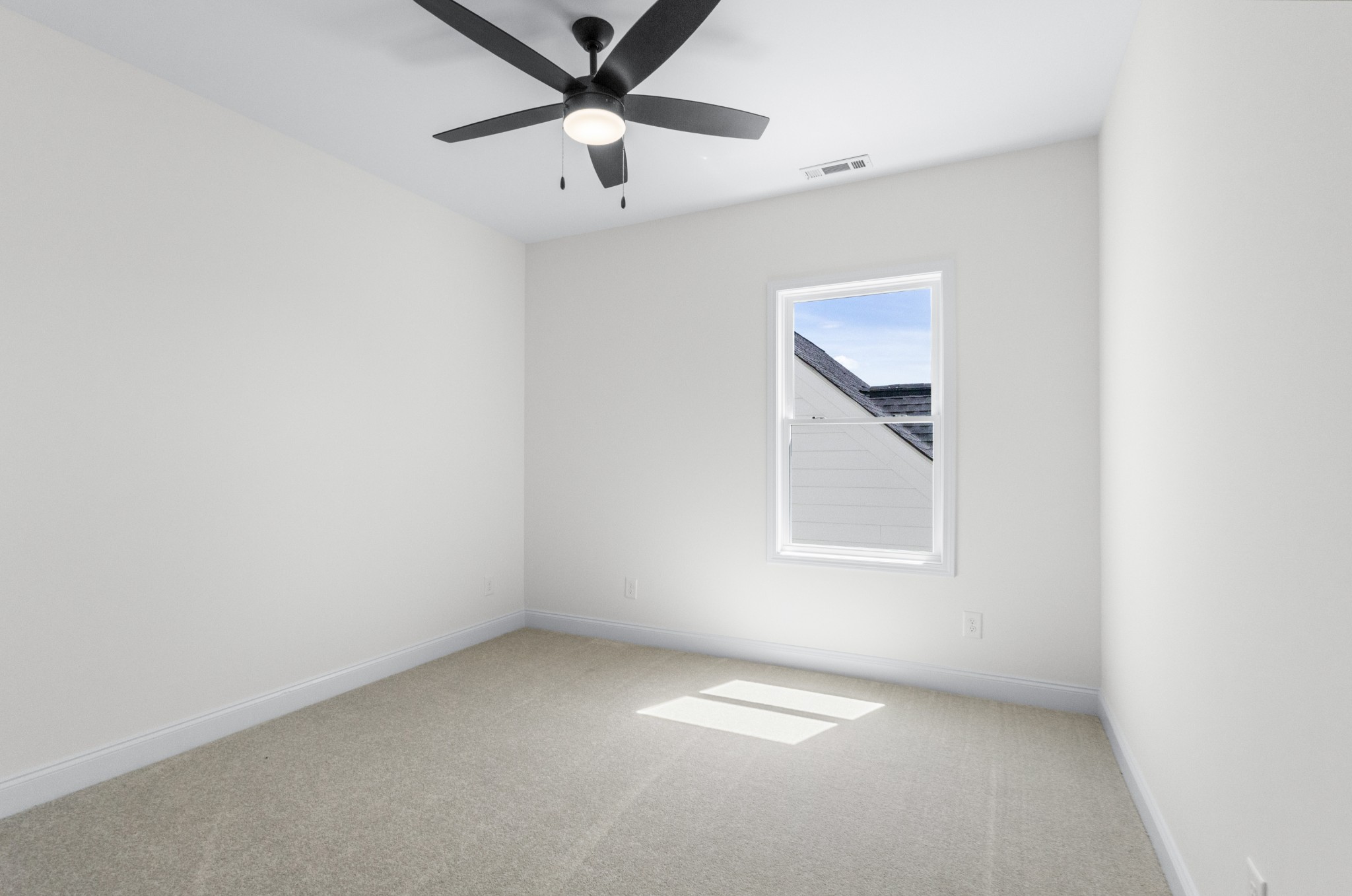 463 Centre Street Pleasant View, TN 37146 - Photo 28 of 43 an empty room with a window and a fan