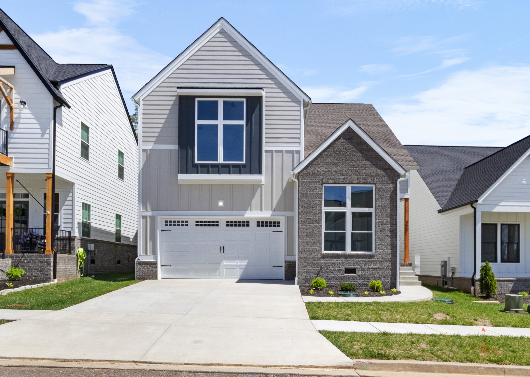 463 Centre Street Pleasant View, TN 37146 - Photo 3 of 43 a front view of a house with garden