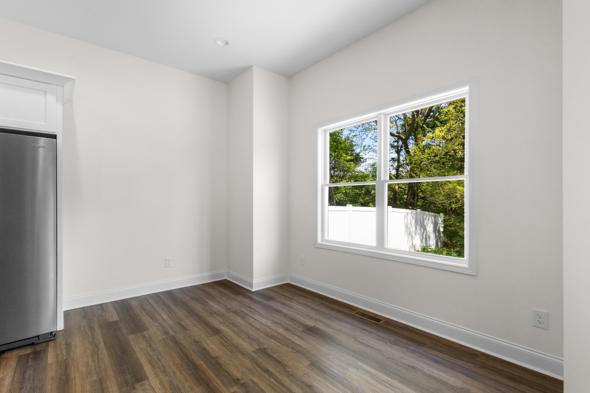 463 Centre Street Pleasant View, TN 37146 - Photo 32 of 43 a view of an empty room with wooden floor and a window