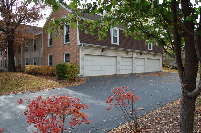 1072 Spring Garden Circle, Unit 4 Naperville, IL 60563 - Photo 14 of 18 front view of a house with a street