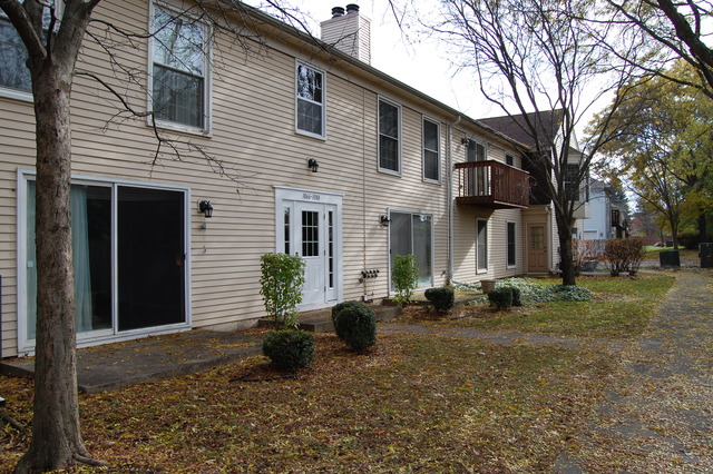 1072 Spring Garden Circle, Unit 4 Naperville, IL 60563 - Photo 16 of 18 a view of a house with a yard