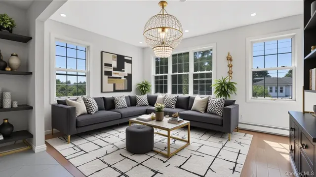 a living room with furniture a table and a large window