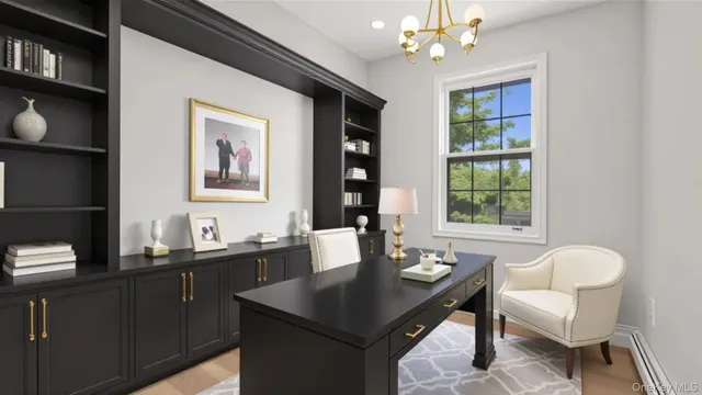 a dining room with a table chairs and chandelier