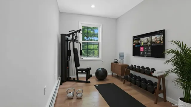 a bedroom with furniture and a window