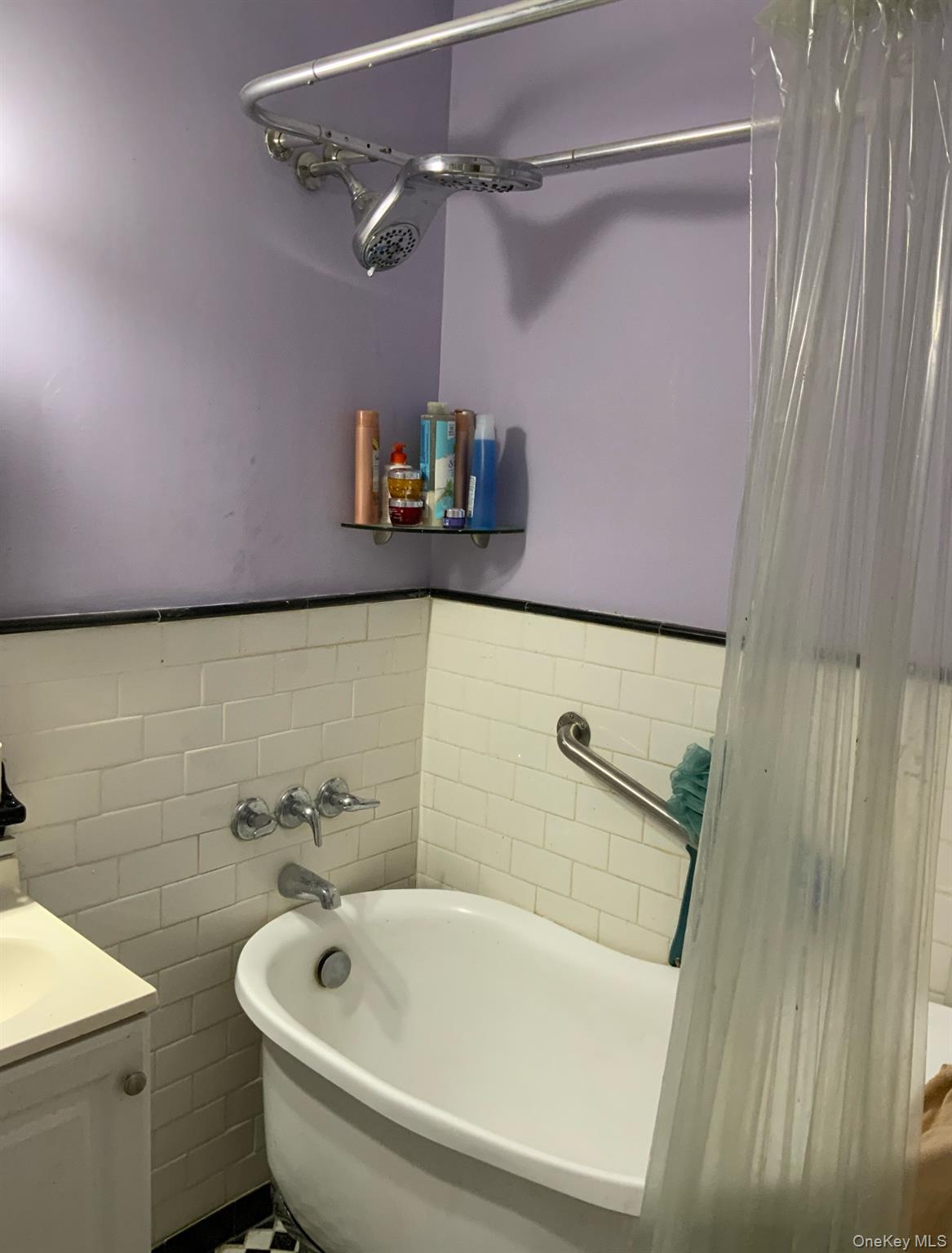 2261 Palmer Avenue, Unit 2A New Rochelle, NY 10801 - Photo 9 of 12 Full bath featuring a tub, tile walls, vanity, and wainscoting
