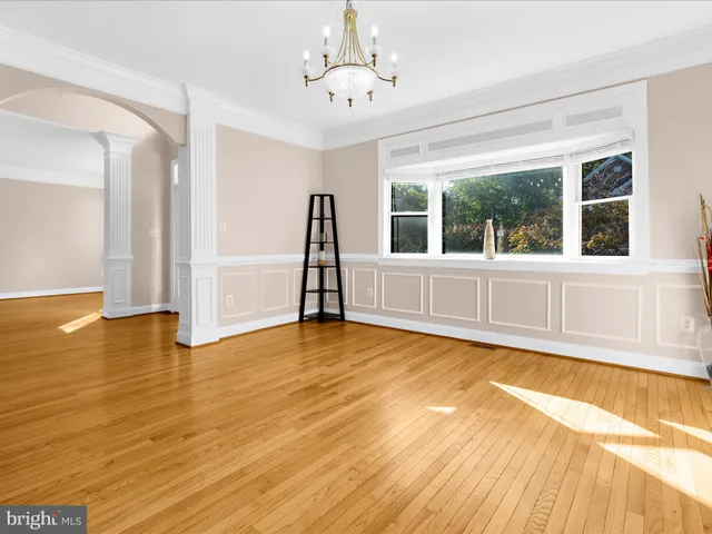 a view of a livingroom with furniture and a flat screen tv