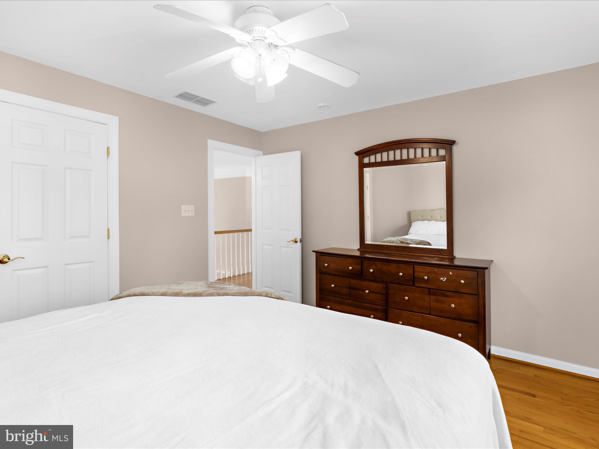 15533 Thompson Road Silver Spring, MD 20905 - Photo 31 of 76 a bedroom with a bed and a dresser