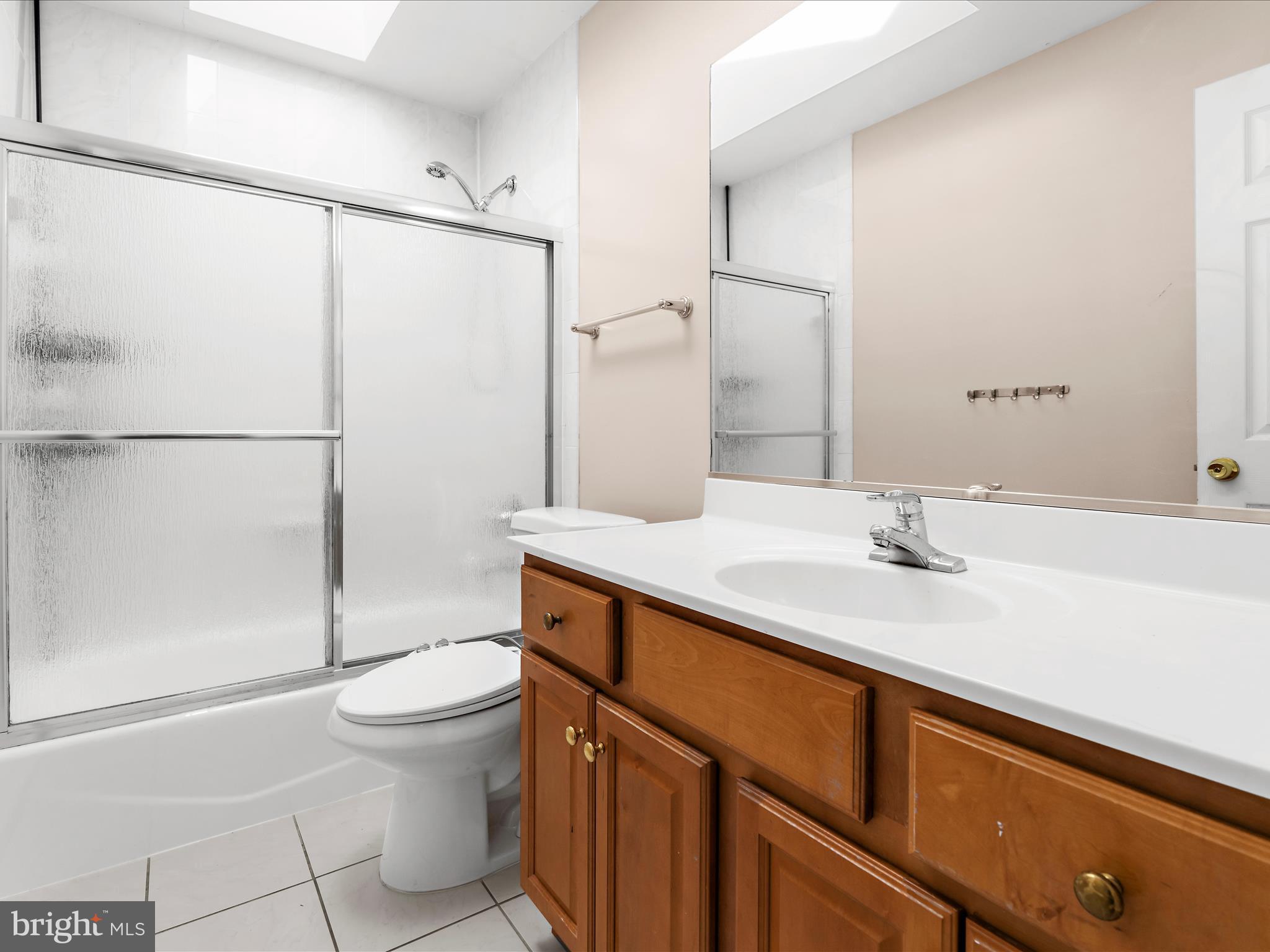15533 Thompson Road Silver Spring, MD 20905 - Photo 32 of 76 a bathroom with a sink a toilet and shower