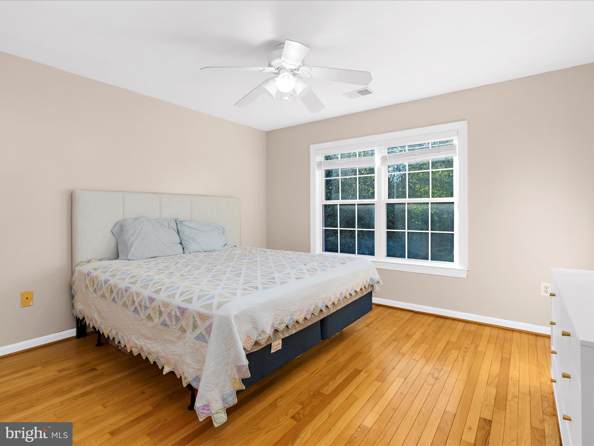 15533 Thompson Road Silver Spring, MD 20905 - Photo 33 of 76 a spacious bedroom with a bed and a window