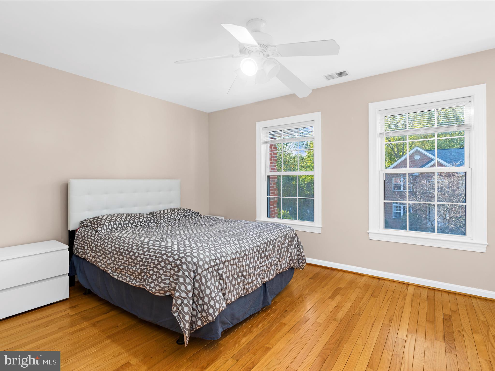 15533 Thompson Road Silver Spring, MD 20905 - Photo 36 of 76 a large bed sitting in a bedroom next to a window