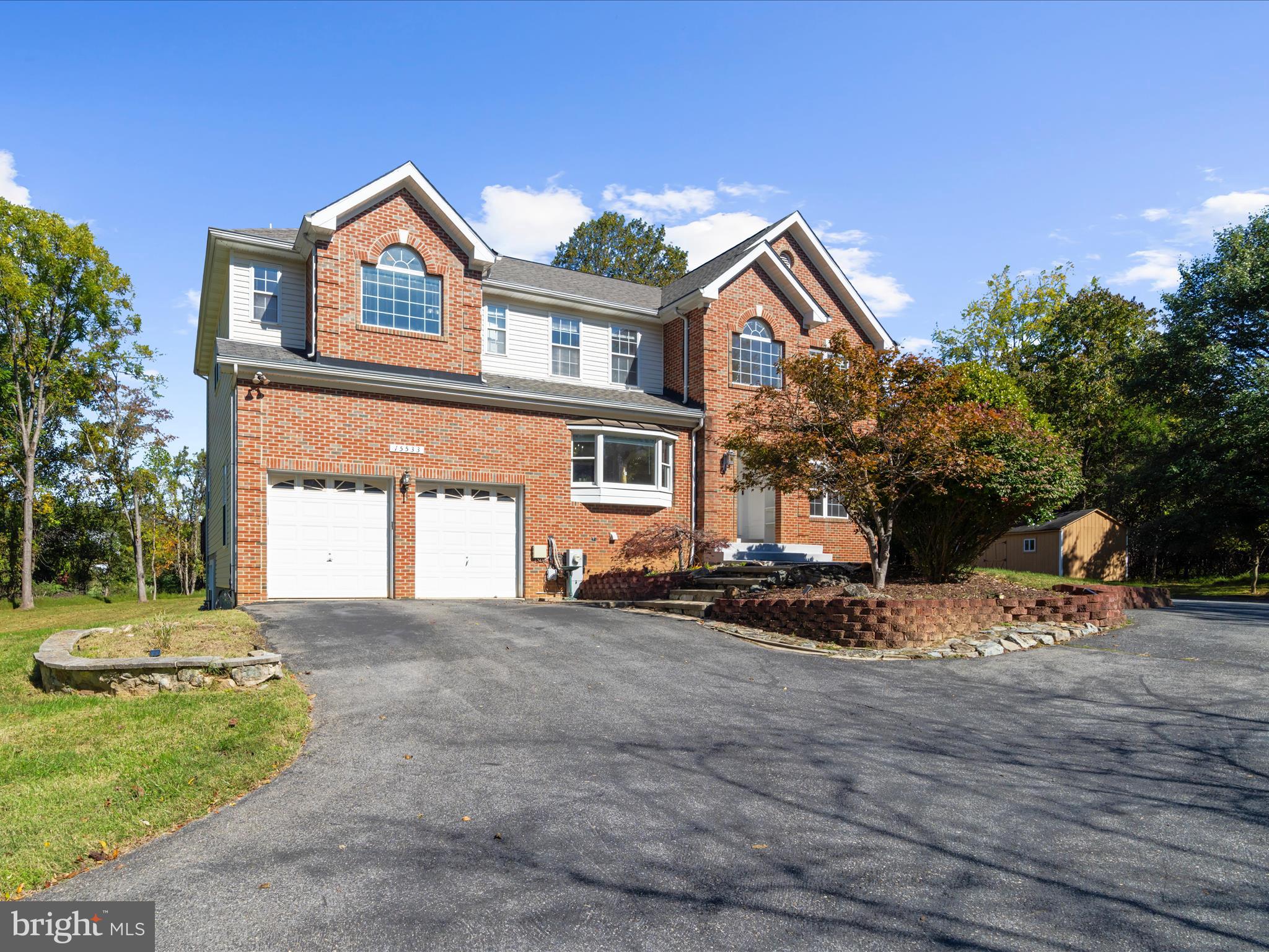 15533 Thompson Road Silver Spring, MD 20905 - Photo 4 of 76 a front view of a house with a yard and garage