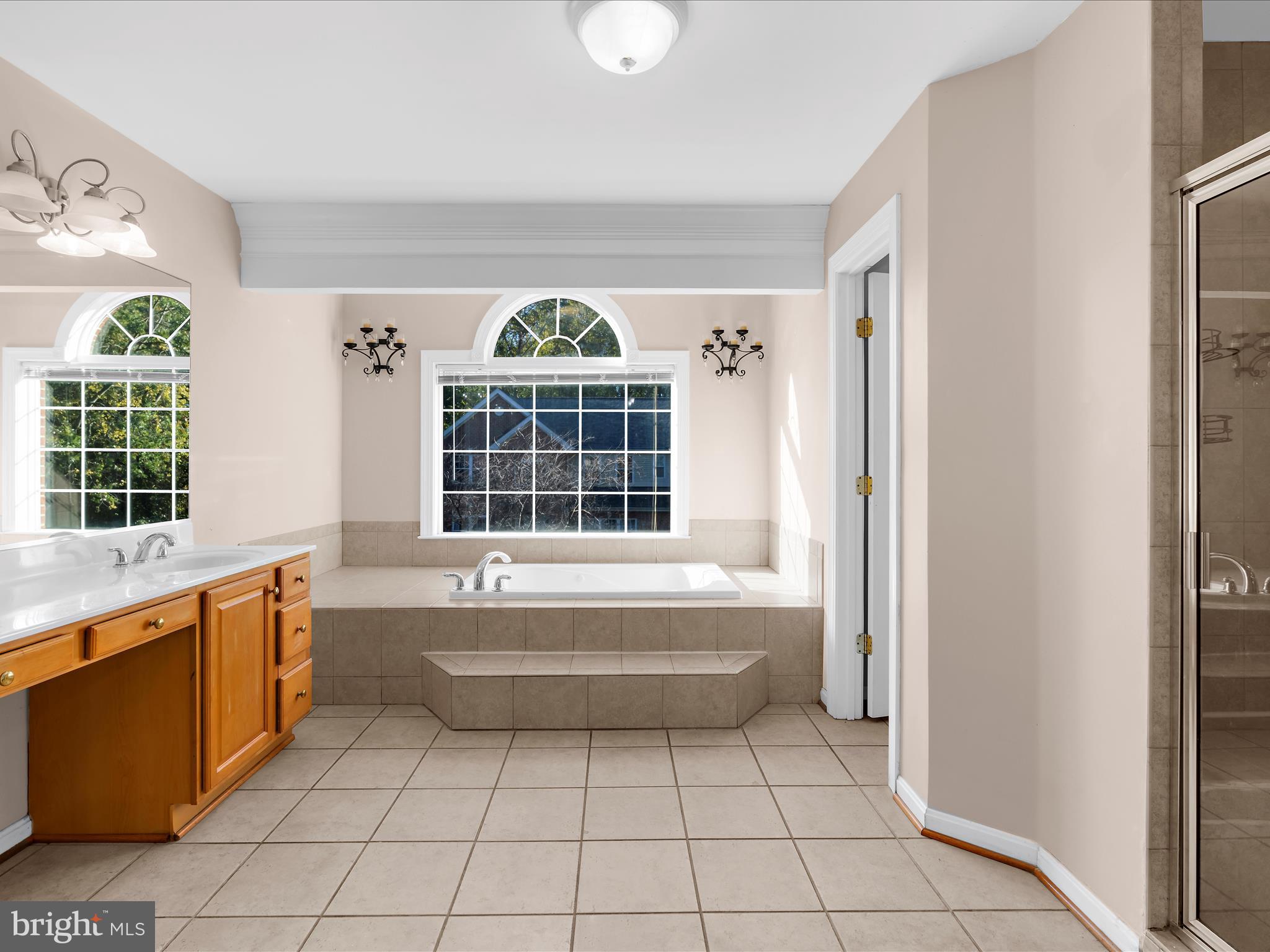 15533 Thompson Road Silver Spring, MD 20905 - Photo 42 of 76 a bathroom with a tub sink and window