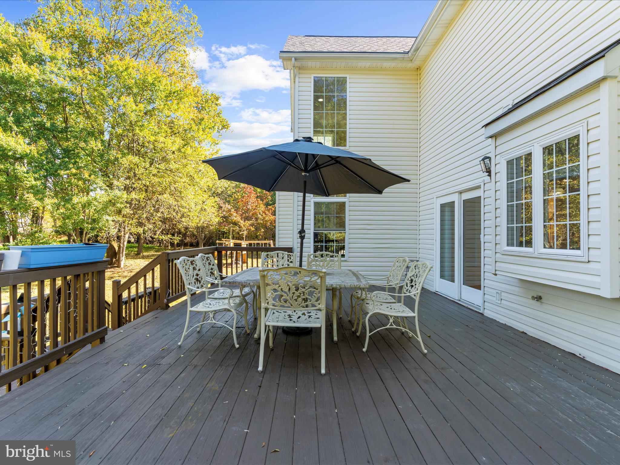 15533 Thompson Road Silver Spring, MD 20905 - Photo 55 of 76 a patio with wooden floor and outdoor seating